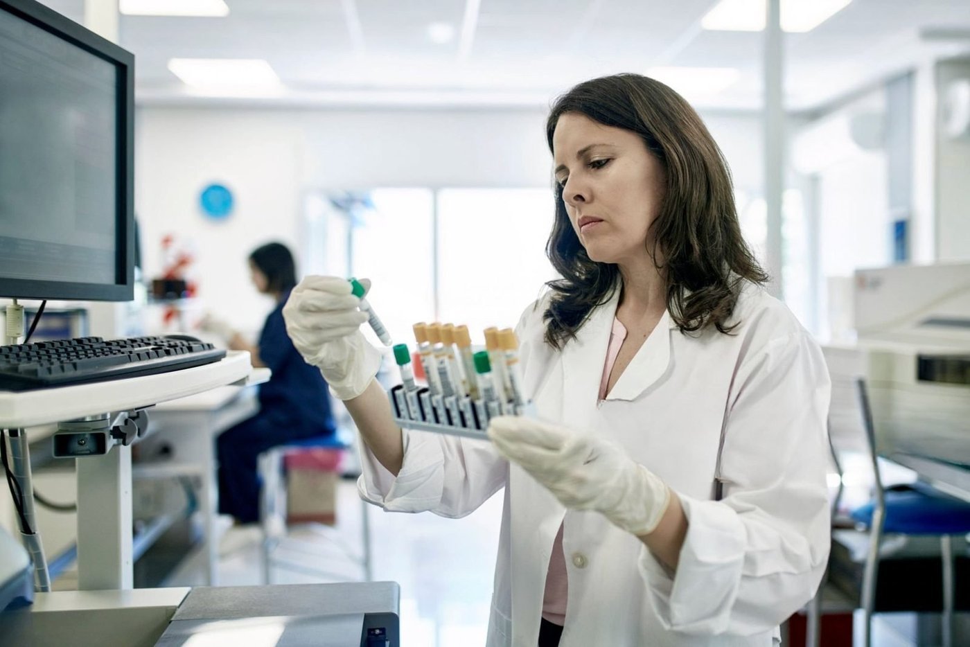 Pathology scientist processing blood samples in an accredited Australian laboratory